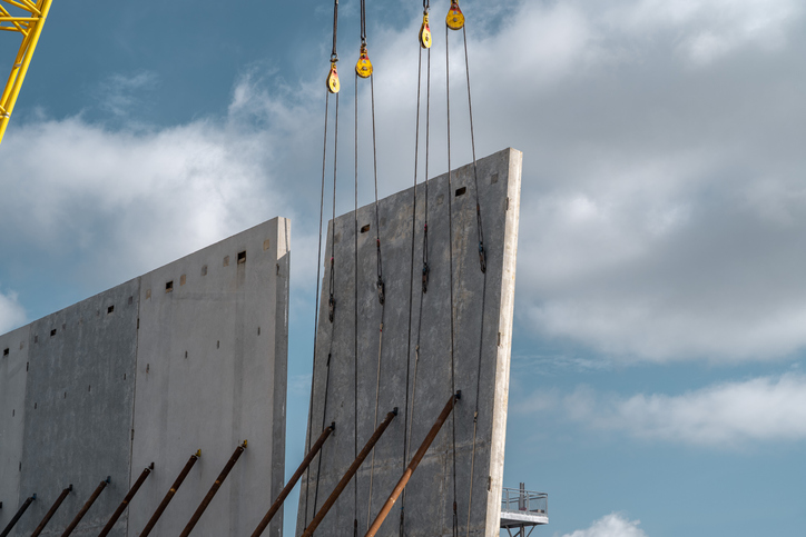 tilt-up construction panels being installed on a job site