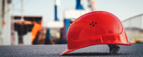 Red construction helmet representing the contact section 